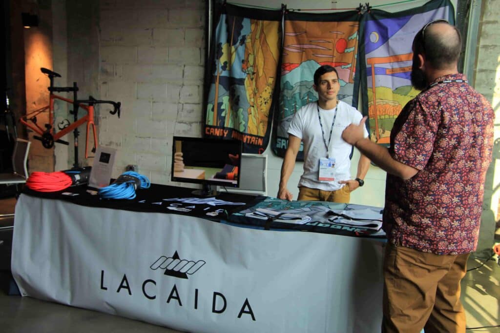 Pedro Somarriba, owner and founder of Lacaida, talks to attendees at the Innovation of Outdoor Recreation Showcase in Bentonville on Sept. 14, 2022. 